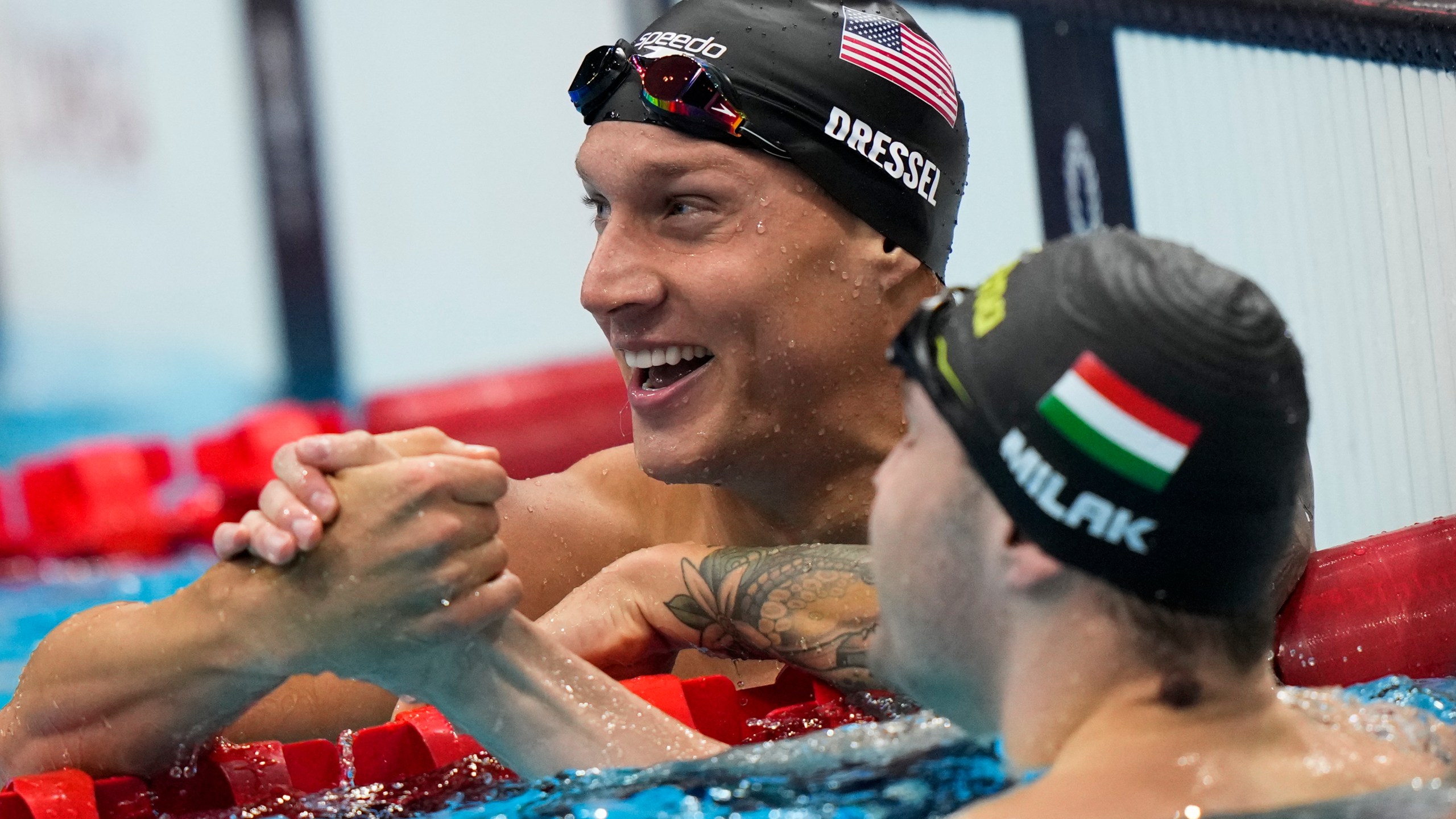 Caeleb Dressel, of United States, celebrates after wining the gold medal in the men's 100-meter butterfly final at the 2020 Summer Olympics, on July 31, 2021, in Tokyo, Japan. (AP Photo/David Goldman)