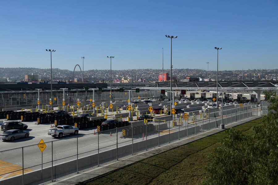 Vehicles enter a border checkpoint at the San Ysidro Port of Entry at the U.S.- Mexico border on Feb. 19, 2021 in San Diego. (PATRICK T. FALLON/AFP via Getty Images)