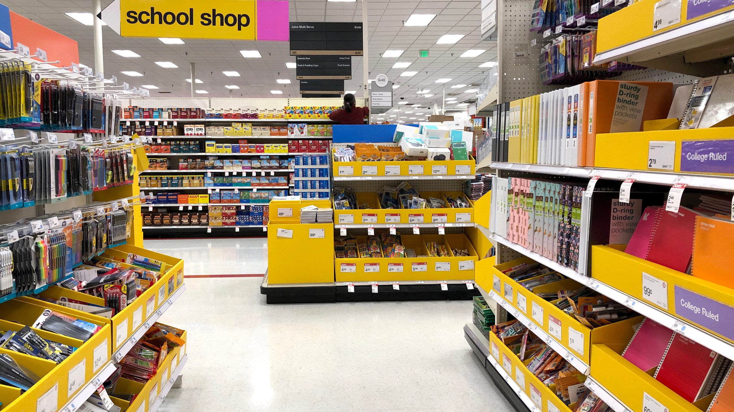 A worker stocks shelves of back-to-school supplies at a Target store on August 03, 2020 in Colma, California. (Photo by Justin Sullivan/Getty Images)