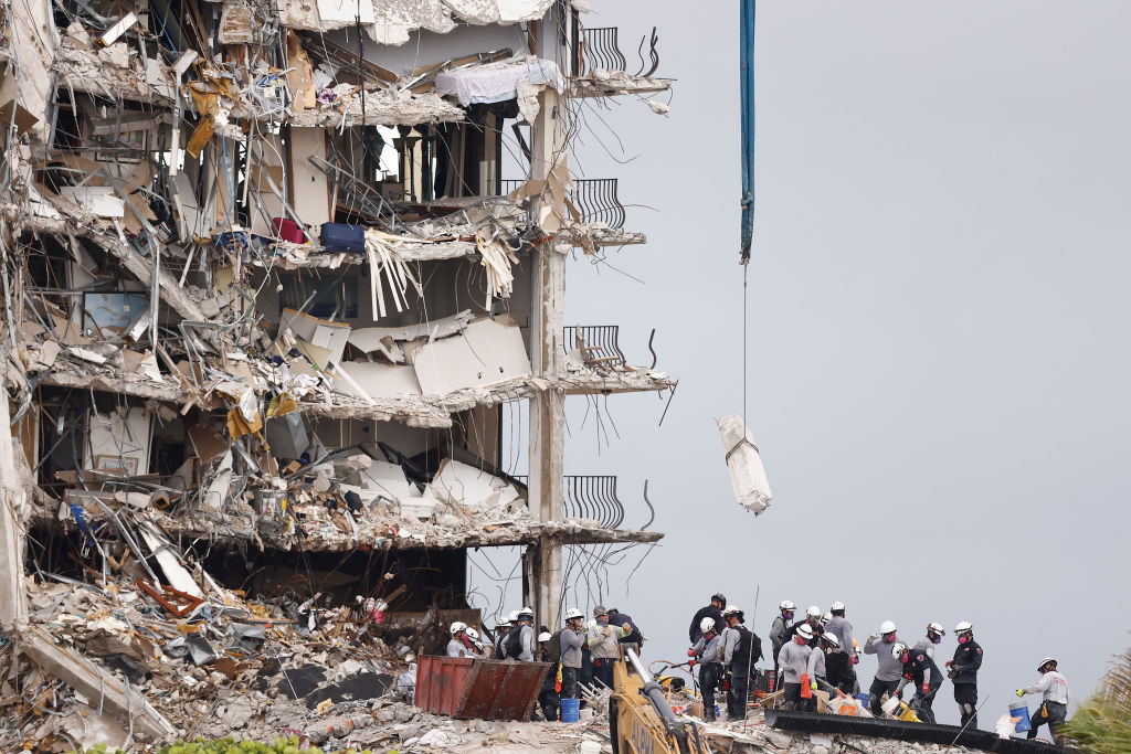 Search and rescue teams look for possible survivors and remains in the partially collapsed 12-story Champlain Towers South condo building on June 30, 2021 in Surfside, Florida. Over 100 people are being reported as missing as the search-and-rescue effort continues. (Photo by Michael Reaves/Getty Images)