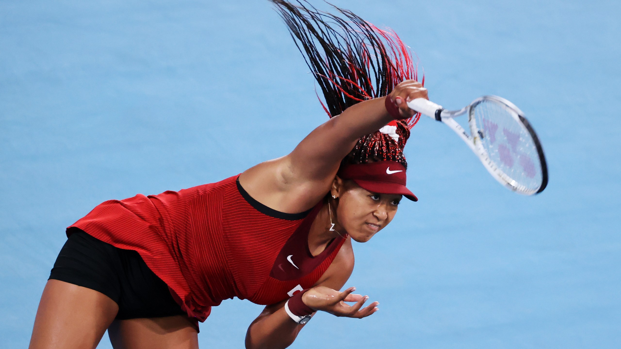 Naomi Osaka of Team Japan serves during her Women's Singles Third Round match against Marketa Vondrousova of Team Czech Republic on day four of the Tokyo 2020 Olympic Games at Ariake Tennis Park on July 27, 2021, in Tokyo, Japan. (Clive Brunskill/Getty Images)