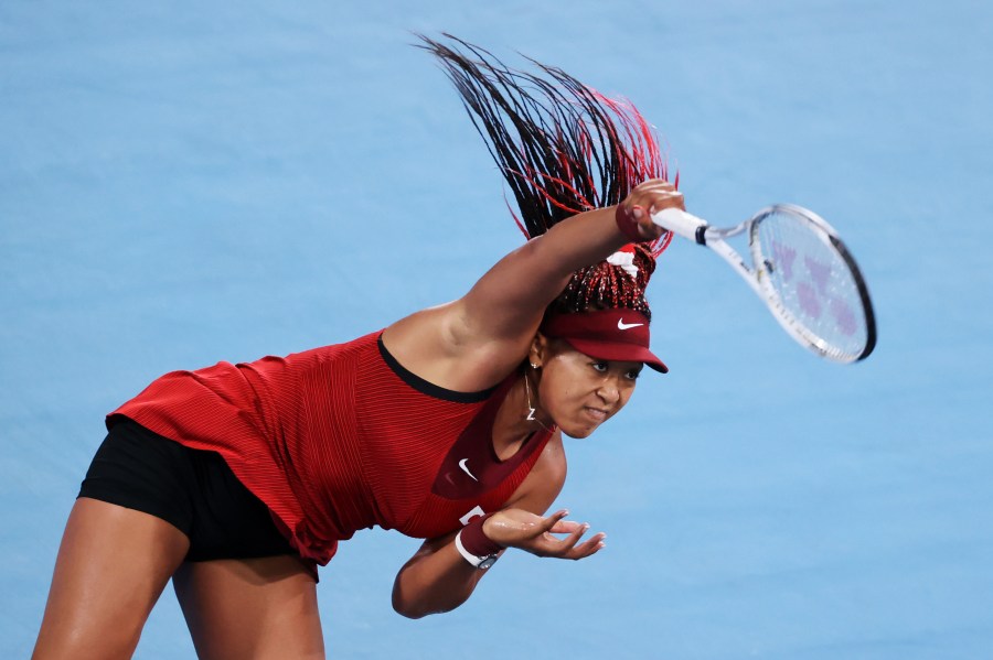 Naomi Osaka of Team Japan serves during her Women's Singles Third Round match against Marketa Vondrousova of Team Czech Republic on day four of the Tokyo 2020 Olympic Games at Ariake Tennis Park on July 27, 2021, in Tokyo, Japan. (Clive Brunskill/Getty Images)