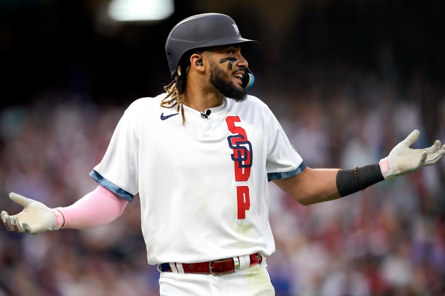 National League's Fernando Tatis Jr., of the San Diego Padres, reacts after flying out during the third inning of the MLB All-Star baseball game, Tuesday, July 13, 2021, in Denver. (AP Photo/David Zalubowski)