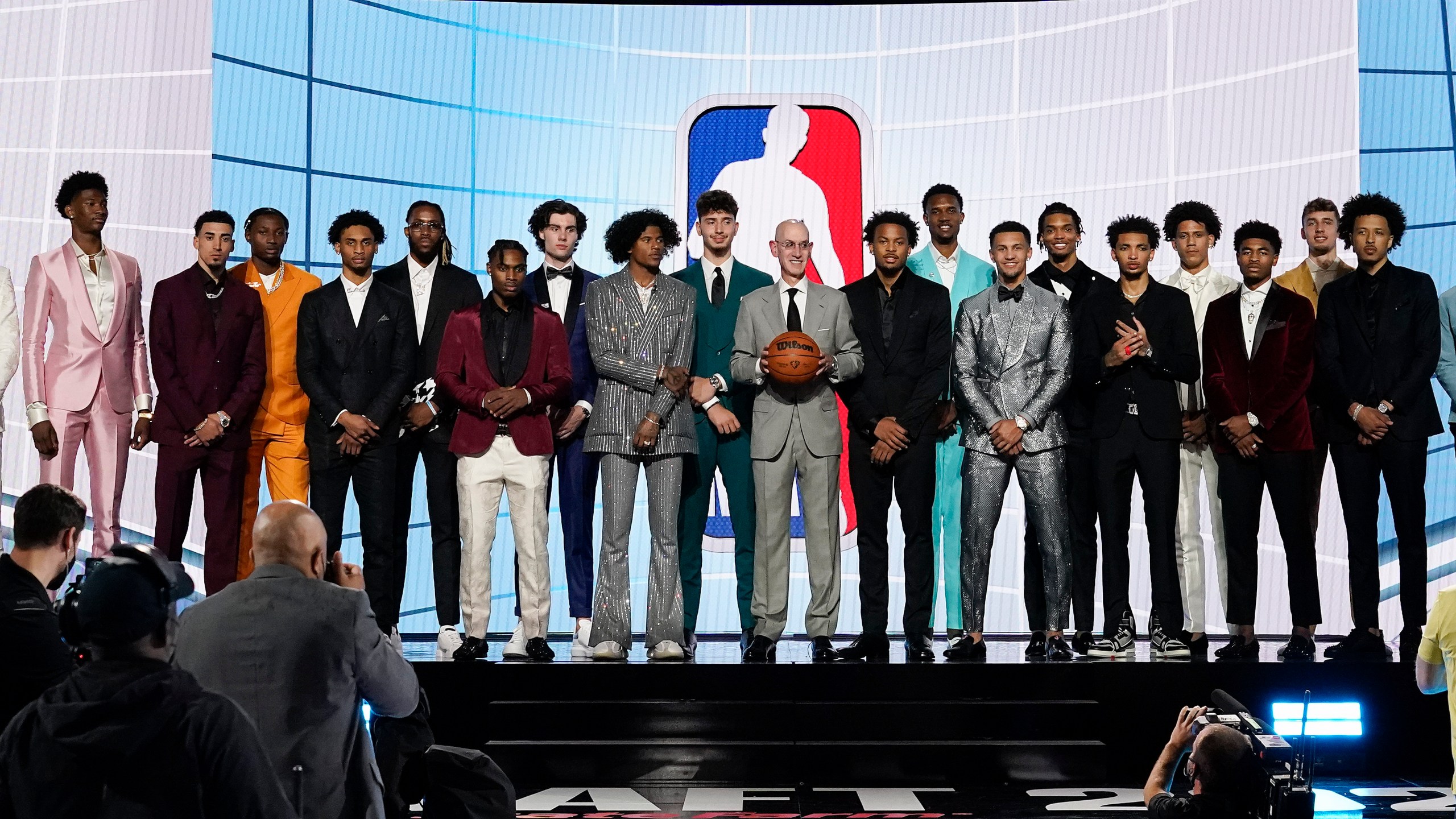 NBA Commissioner Adam Silver, center, poses for a photo with players projected to be first-round draft picks before the NBA basketball draft, Thursday, July 29, 2021, in New York. (AP Photo/Corey Sipkin)