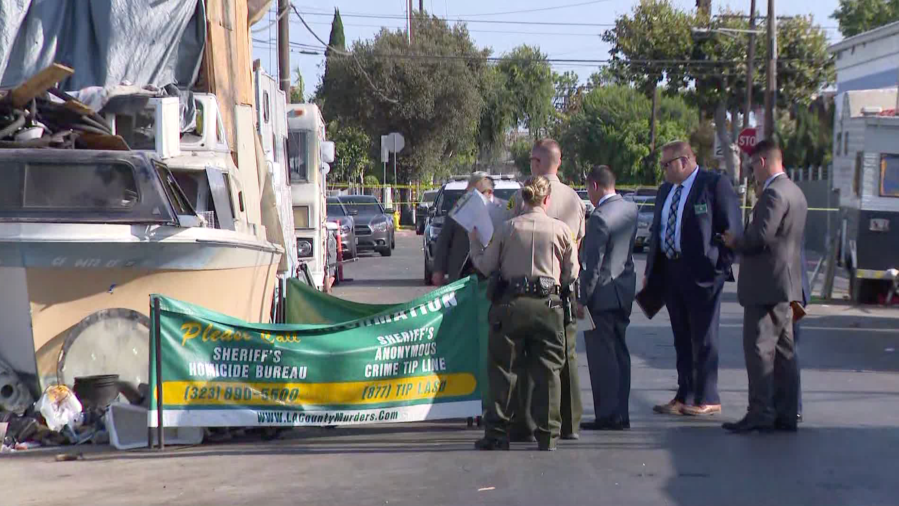 Authorities respond to investigate a fatal shooting in the Florence-Firestone neighborhood of South Los Angeles on July 9, 2021. (KTLA)