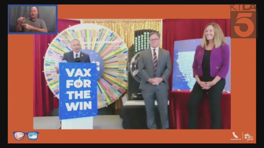 Dr. Tomás J. Aragón (left), state public health officer and California Department of Public Health director, is joined by Sen. Josh Newman (middle) and Asm. Jacqui Irwin in the drawing of six winners for the “California Dream Vacations” giveaway as part of the state’s vaccine incentive program on July 1, 2021.