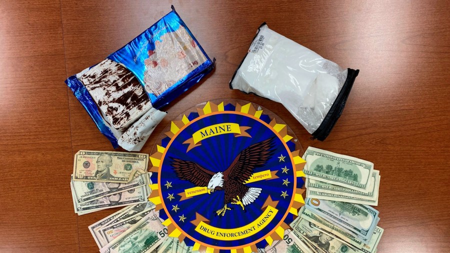 This undated photo provided by the Maine Drug Enforcement Agency shows a marble cake which contained about 2 pounds of cocaine, and cash, seized from a vehicle in Gardiner, Maine. A New York man and a Maine woman are facing charges, Wednesday, July 21, 2021, after the cocaine disguised as a cake was seized from their vehicle, authorities said. (Maine Drug Enforcement Agency via AP)