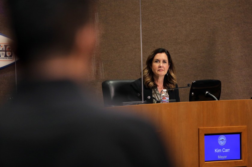 Huntington Beach Mayor Kim Carr listens to a candidate speak on July 9, 2021, amid a stalemate over appointing a person to fill the seat left vacant by the resignation of Tito Ortiz. (Scott Smeltzer / L.A. Times Community News)