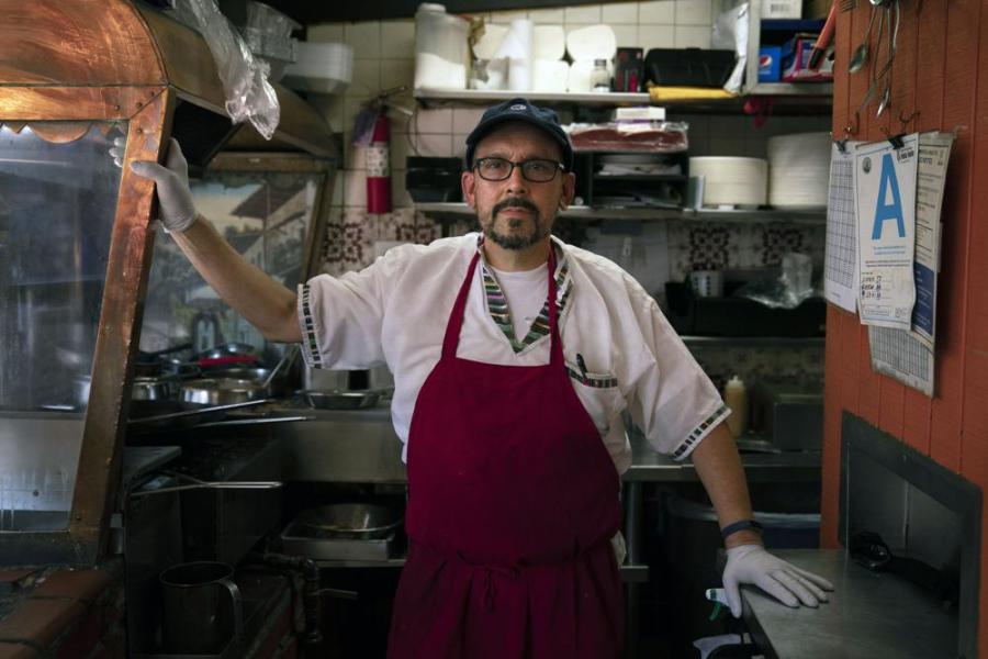 Edward Flores, 56, a fourth-generation owner of Juanita's Cafe on Olvera Street, stands for a photo in his restaurant in Los Angeles, Friday, June 4, 2021. (AP Photo/Jae C. Hong)