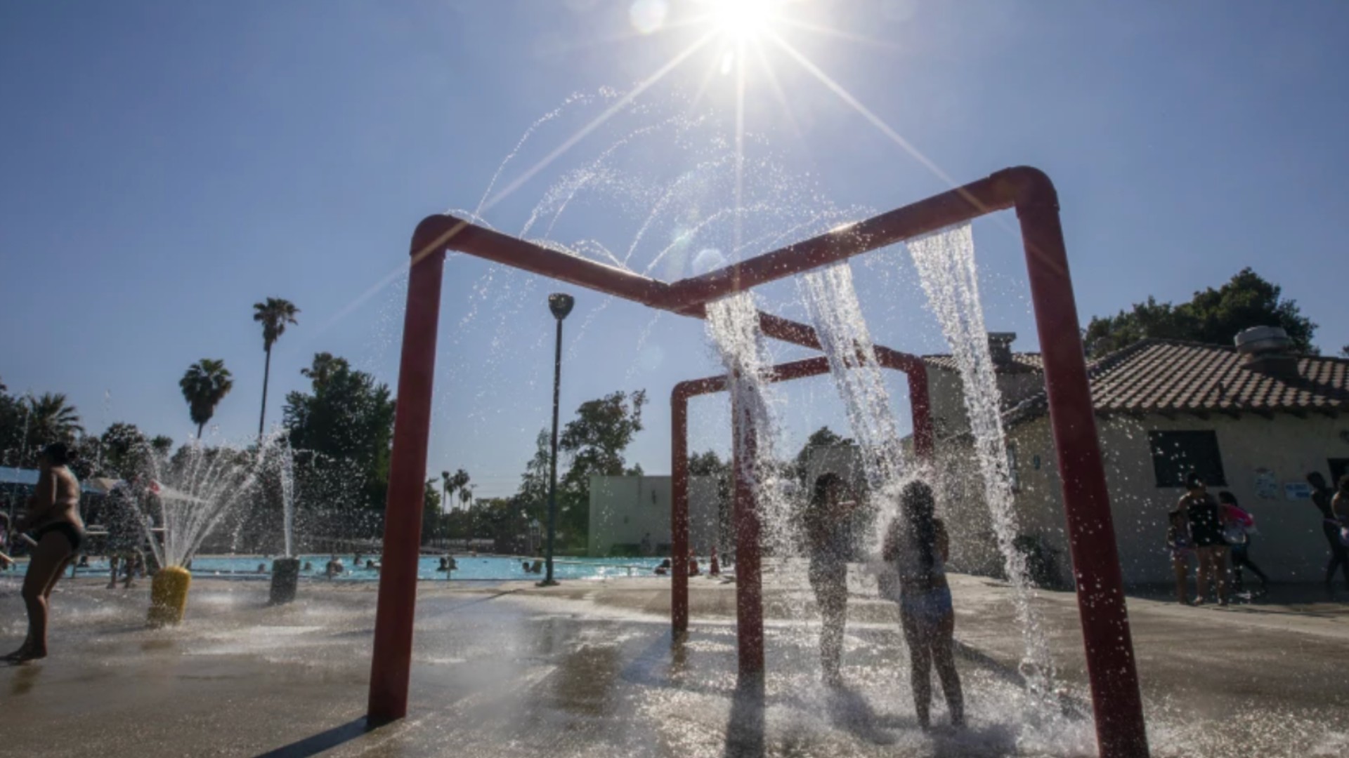 Children cool down at the Jerry Lewis Family Swim Center in San Bernardino on Sunday.(Francine Orr / Los Angeles Times)