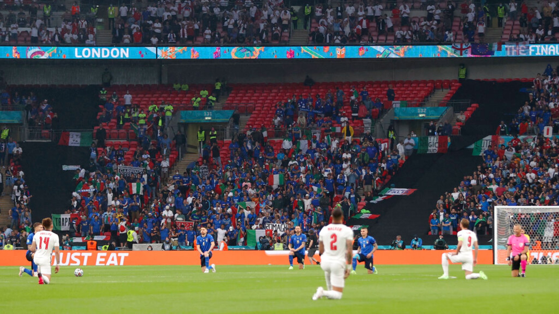 The players take a knee before the Euro 2020 soccer championship final match between England and Italy at Wembley stadium in London, Sunday, July 11, 2021. (Carl Recine/Pool Photo via AP)