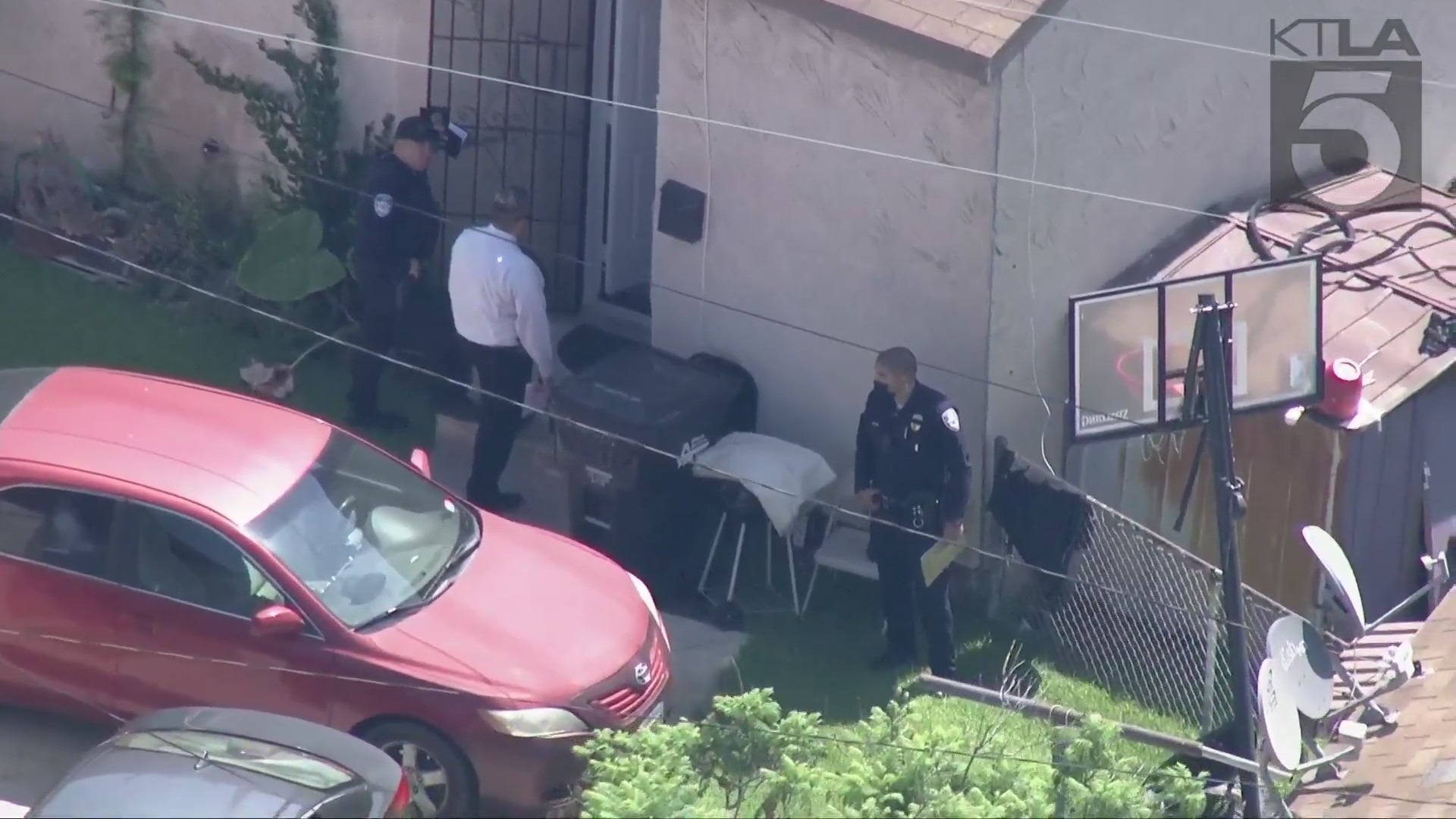 Authorities investigate after a woman was found dead in Bell Gardens on July 28, 2021. (KTLA)