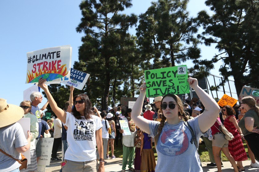 A large crowd is seen gathered to draw attention to climate change in Irvine in September 2019. (Raul Roa / L.A. Times Community News)