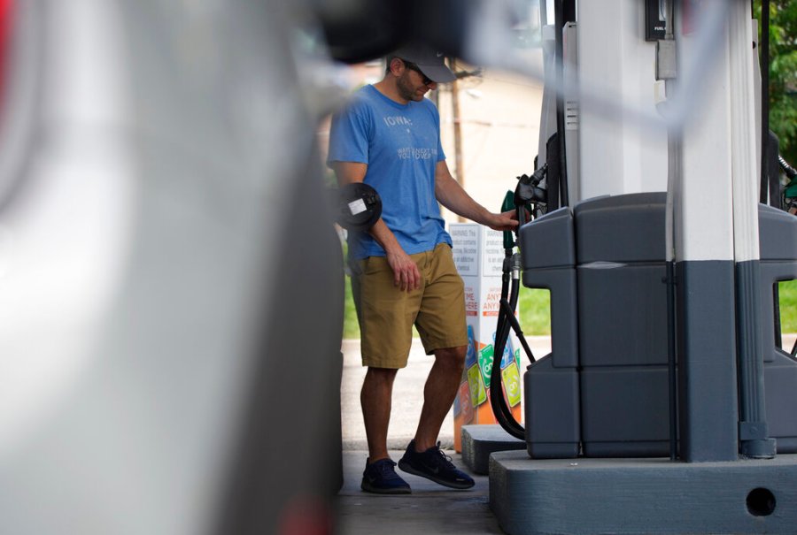 A motorist prepares to fill up the gasoline tank on his vehicle at a Shell station Thursday, July 22, 2021, in southeast Denver. (AP Photo/David Zalubowski)