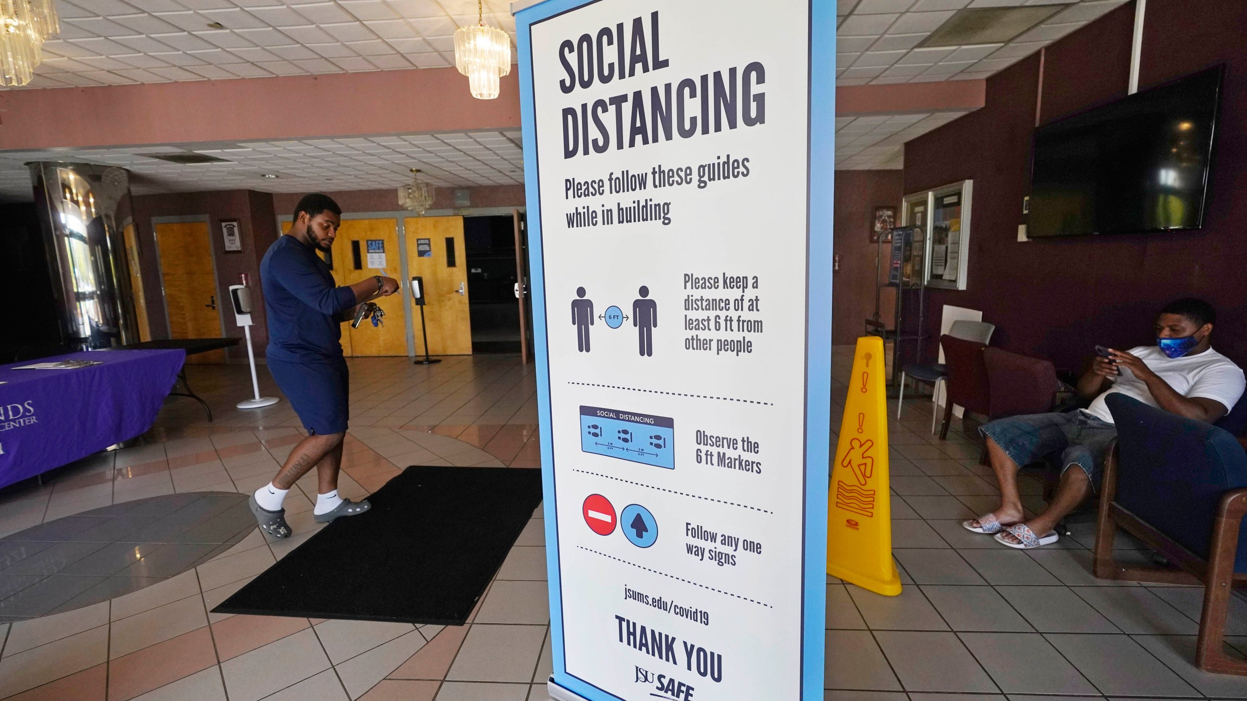 In this July 27, 2021 file photo, social distancing as well as face covering is recommended at the COVID-19 vaccination site in the Rose E. McCoy Auditorium on the Jackson State University campus in Jackson, Miss. (AP Photo/Rogelio V. Solis, File)