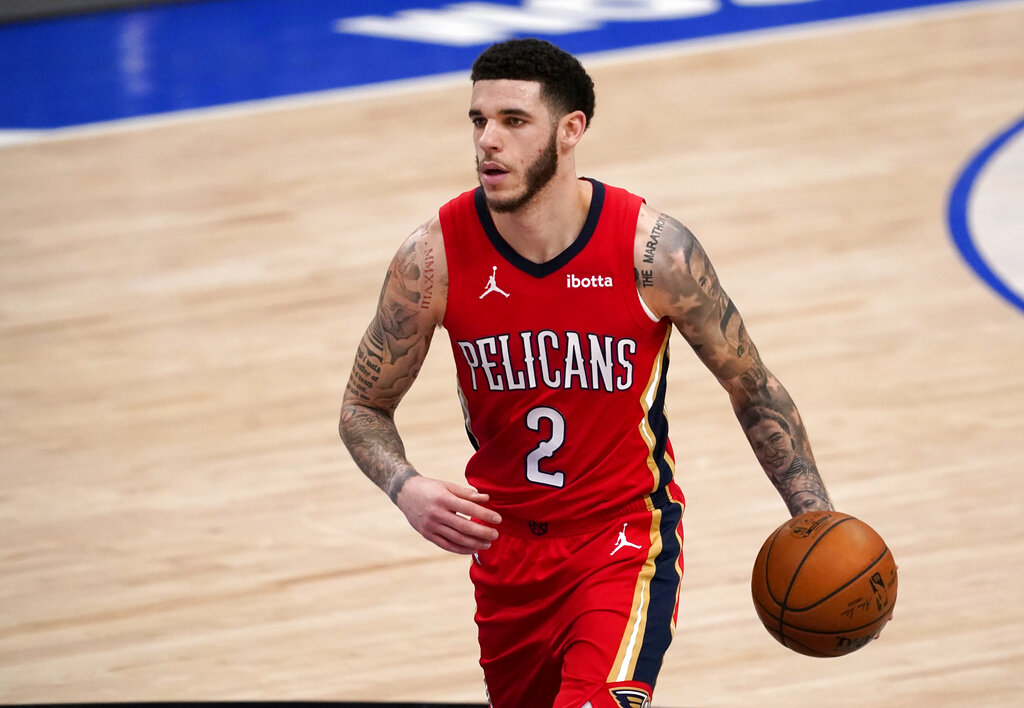 In this Feb. 12, 2021, file photo, New Orleans Pelicans' Lonzo Ball brings the ball up during the team's NBA basketball game against the Dallas Mavericks in Dallas. (AP Photo/Tony Gutierrez, File)