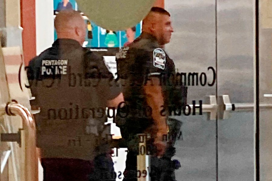 Pentagon police officers walk near the facility’s Metro station, Tuesday, Aug. 3, 2021, at the Pentagon in Washington. (AP Photos/Sagar Meghani)