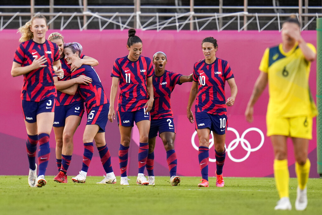 United States' Megan Rapinoe celebrates with teammates scoring her side's 2nd goal against Australia in the women's bronze medal soccer match at the 2020 Summer Olympics, Thursday, Aug. 5, 2021, in Kashima, Japon. (AP Photo/Fernando Vergara)