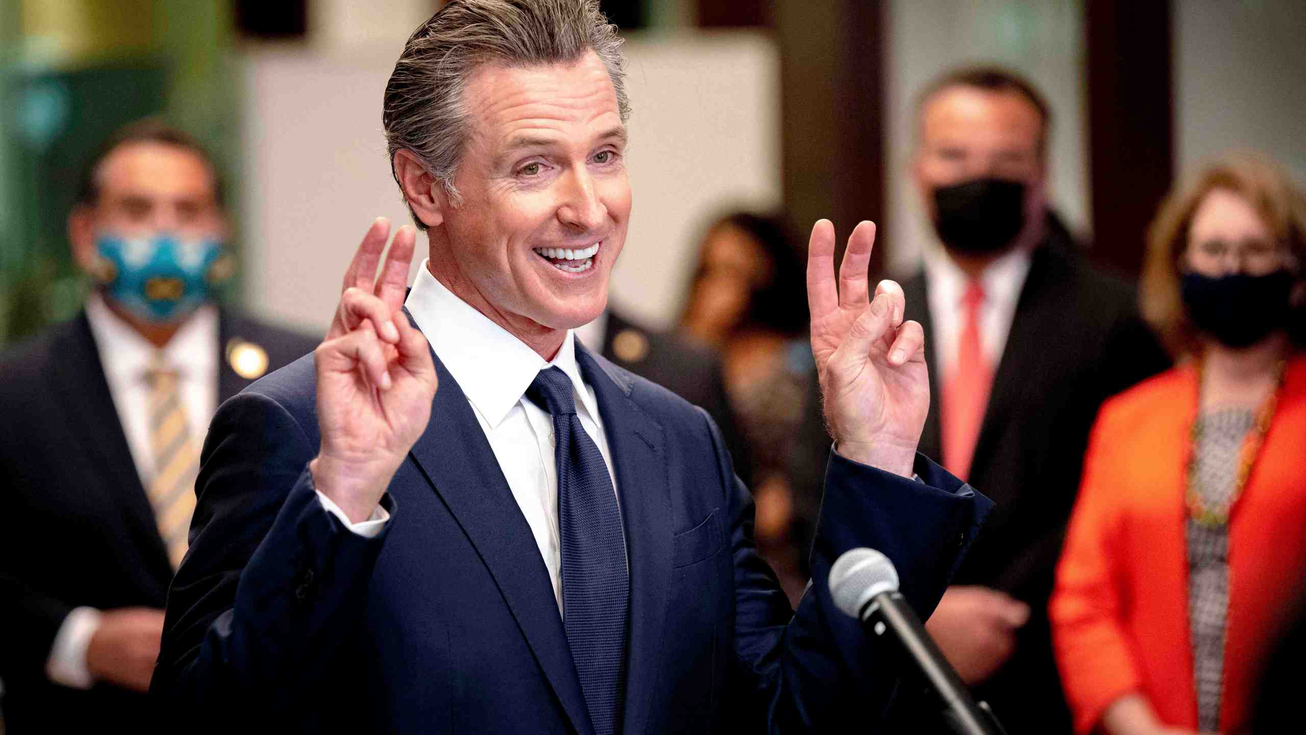 California Gov. Gavin Newsom makes a gesture as he speaks during a news conference at San Bernardino Unified School District Office after visiting Juanita B. Jones Elementary School in San Bernardino, Calif., Friday, Aug. 6, 2021. (Watchara Phomicinda/The Orange County Register via AP)