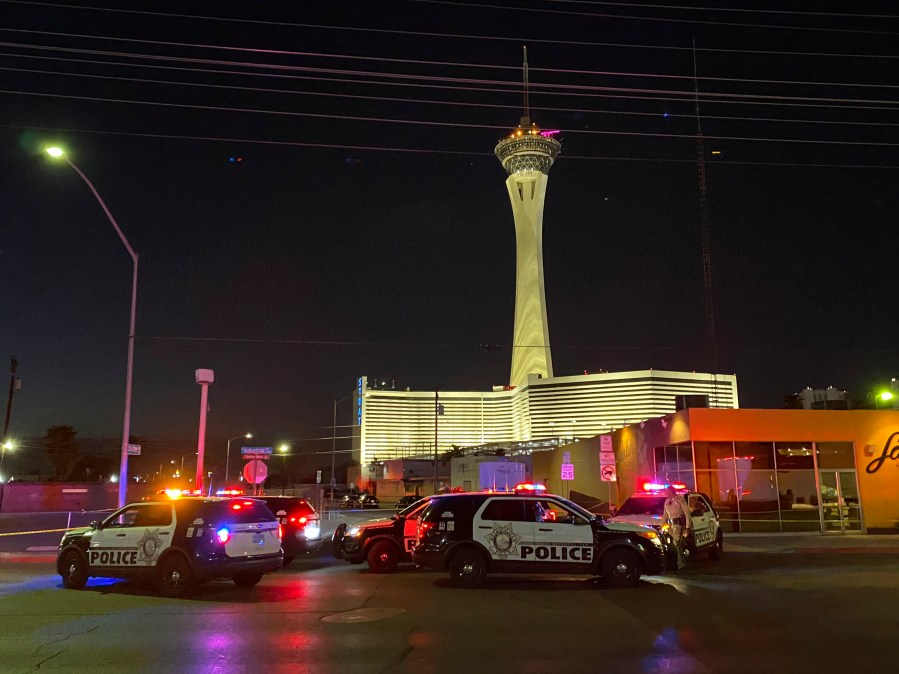 Las Vegas police investigate a shooting on Chicago Avenue in Las Vegas, Tuesday, Aug. 10, 2021. The shooting, apparently involving a landlord-tenant dispute, left two renters dead, one critically wounded with nine gunshot wounds and their landlord in custody as the suspect, Las Vegas police said Tuesday. (Glenn Puit/Las Vegas Review-Journal via AP)