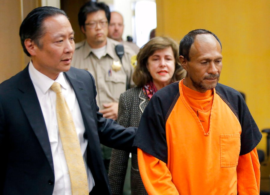 In this July 7, 2015 file pool photo, Juan Francisco Lopez-Sanchez, right, is lead into the courtroom for his arraignment at the Hall of Justice in San Francisco. (Michael Macor/San Francisco Chronicle via AP, File)