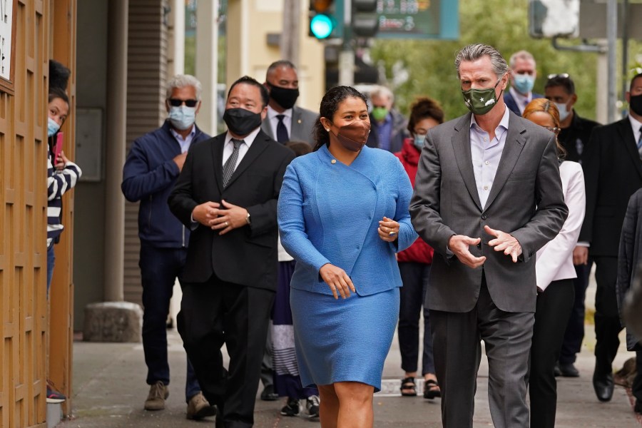 In this June 3, 2021 file photo California Gov. Gavin Newsom walks with San Francisco Mayor London Breed on Geary Street to a news conference outside Tommy's Mexican Restaurant in San Francisco. (Eric Risberg/Associated Press)