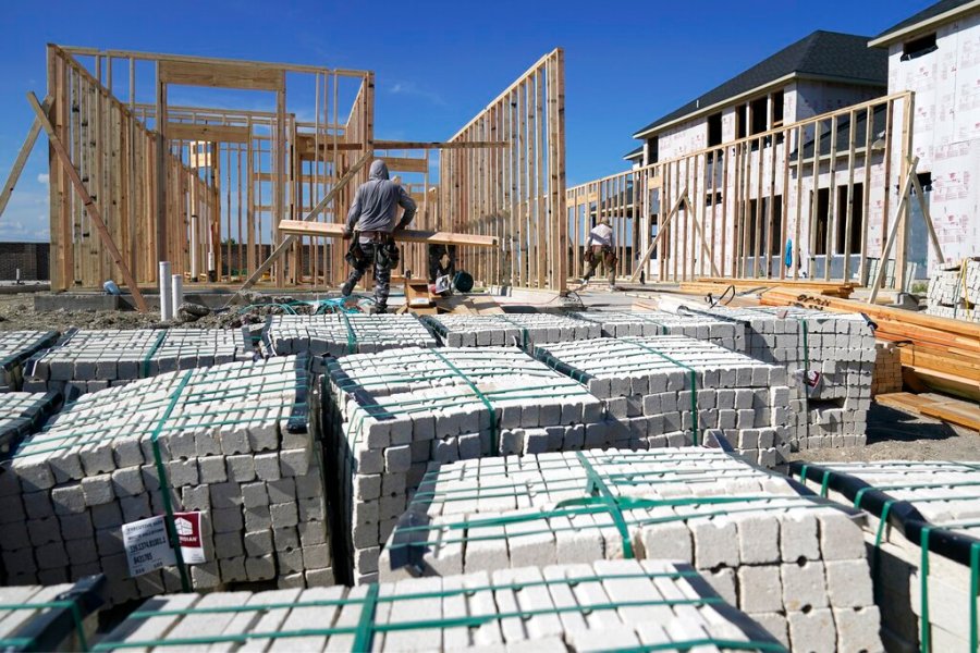 Workers erect the frame of a home being built in a new subdivision in Allen, Texas, Thursday, Aug. 12, 2021. (AP Photo/Tony Gutierrez)