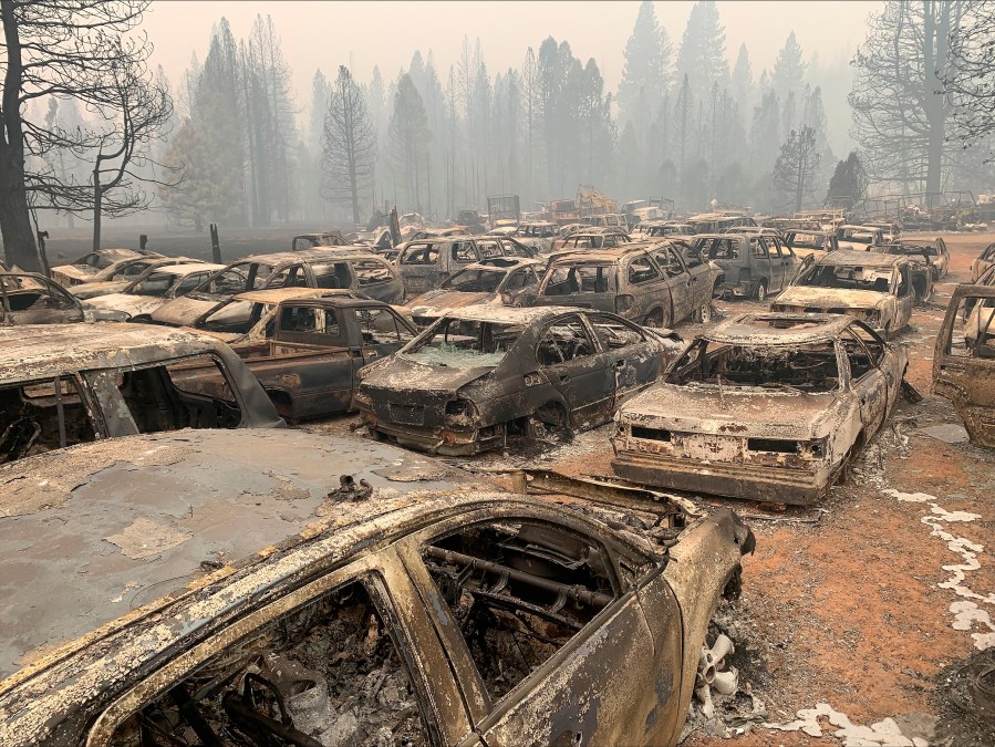 Burnt vehicles are seen in Greenville, Calif., after the Dixie Wildfire Thursday, Aug. 12, 2021. California's largest single wildfire in recorded history is running through forestlands as fire crews try to protect rural communities from flames that have destroyed hundreds of homes. The Dixie Fire is the largest single fire in California history and the largest currently burning in the U.S. It is about half the size of the August Complex, a series of lightning-caused 2020 fires across seven counties that were fought together and that state officials consider California's largest wildfire overall. (AP Photo/Eugene Garcia)