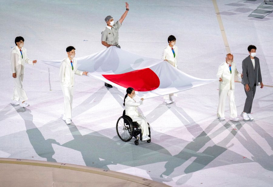 Athletes from Japan Miki Matheson, Mineho Ozaki, Taiyou Imai, Erina Yuguchi, Kaori Icho, and Tskumi Asatani carry the national flag of Japan into the Olympic Stadium at the start of the Paralympic Opening Ceremony Tokyo 2020 Paralympic Games in Tokyo, Tuesday, Aug. 24, 2021. (Joe Toth for OIS via AP)