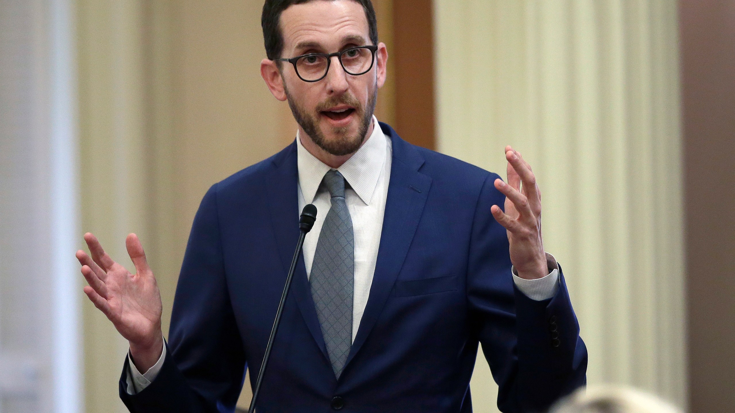 In this June 28, 2018, file photo, state Sen. Scott Wiener, D-San Francisco, talks during a Senate session in Sacramento, Calif. California lawmakers will wait until next year to consider decriminalizing psychedelics. Sen. Scott Wiener said Thursday, Aug. 26, 2021 that he will keep working to persuade the public and legislators that it’s a good idea. (AP Photo/Rich Pedroncelli, File)