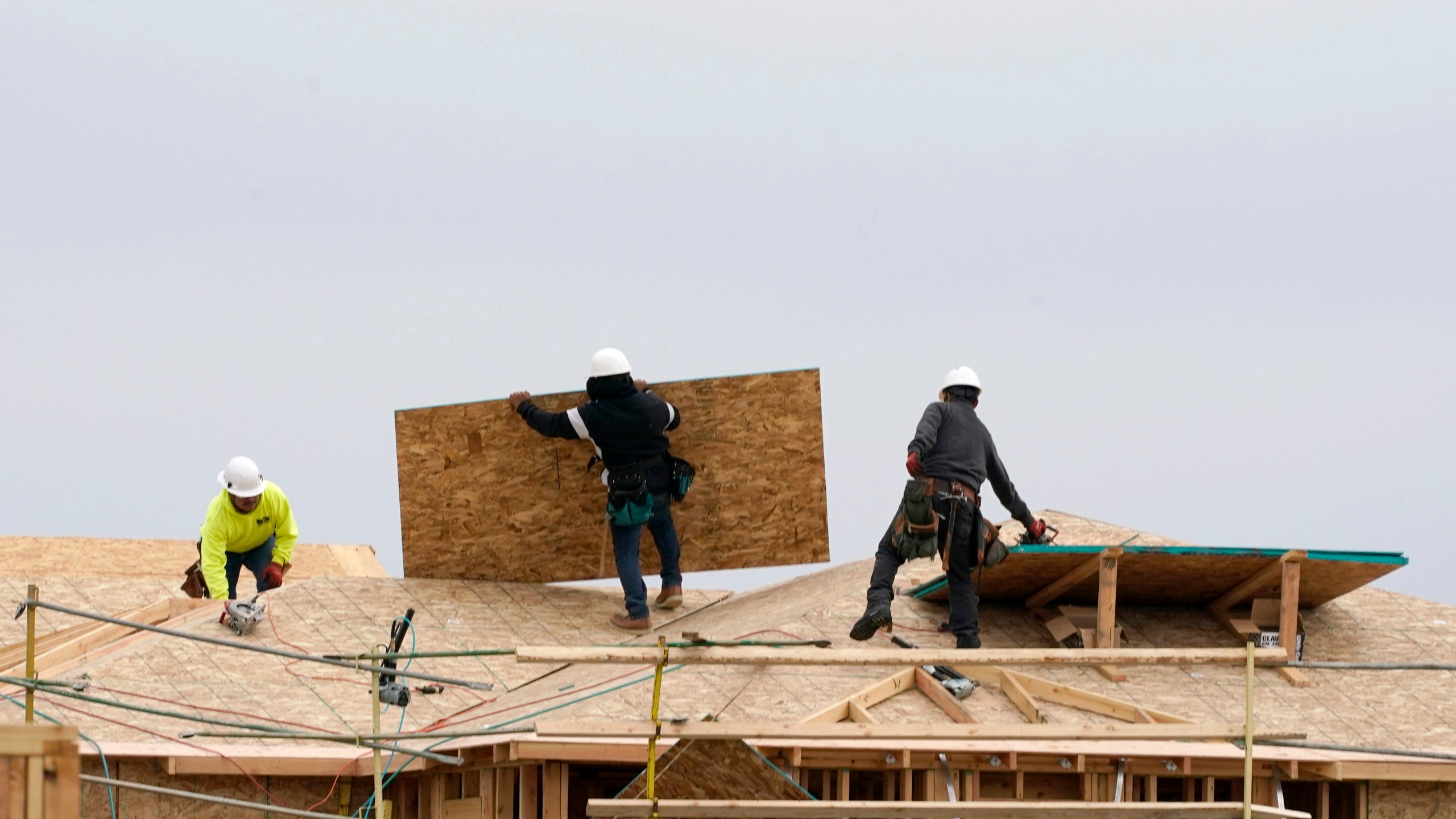 In this Feb. 11, 2021, file photo, work is done on a house under construction in Sacramento, Calif. (AP Photo/Rich Pedroncelli, File)