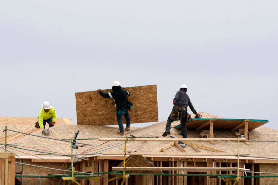 In this Feb. 11, 2021, file photo, work is done on a house under construction in Sacramento, Calif. (AP Photo/Rich Pedroncelli, File)