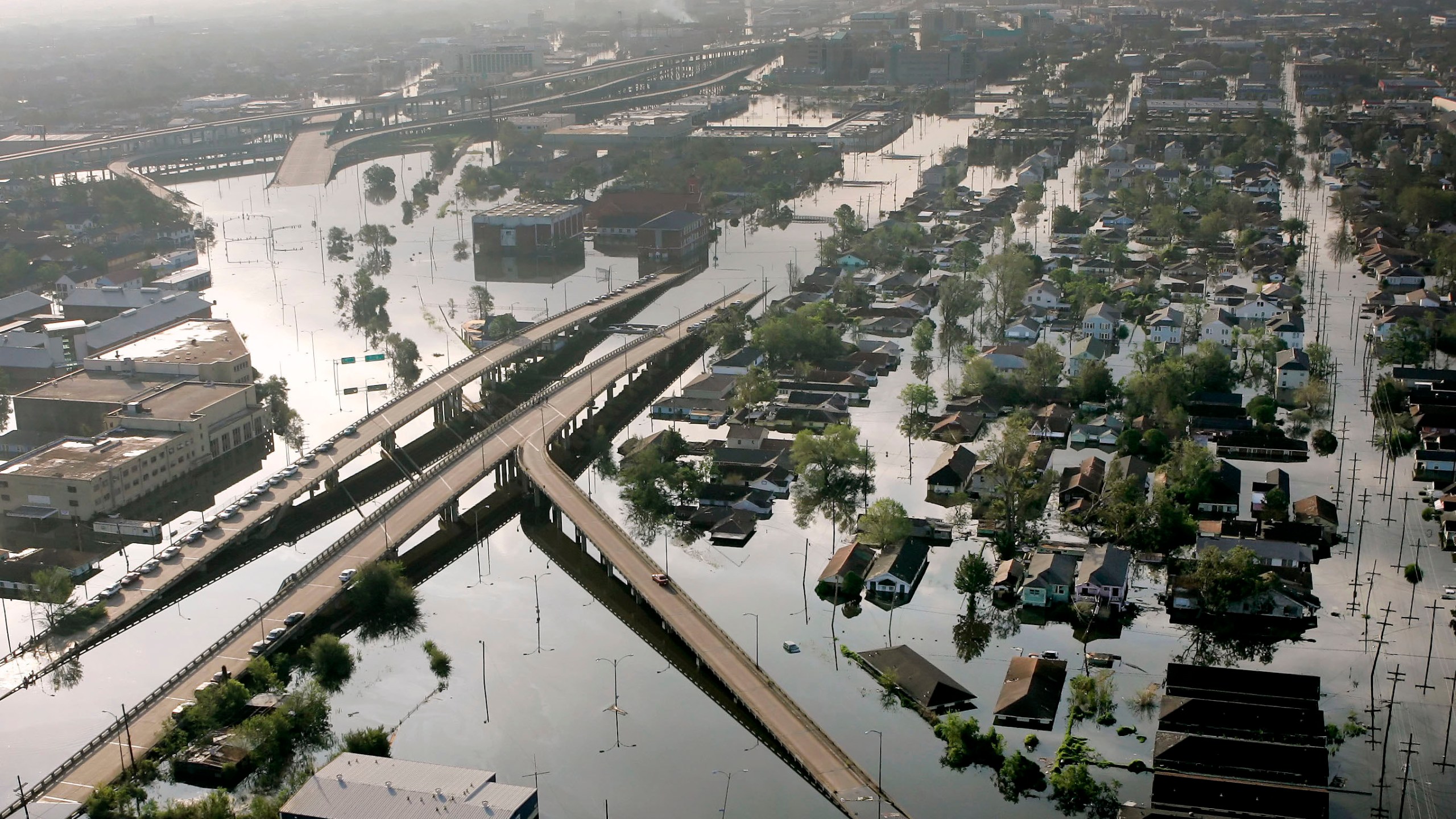 In this Aug. 30, 2005 file photo, Floodwaters from Hurricane Katrina fill the streets near downtown New Orleans. Hurricane Ida looks an awful lot like Hurricane Katrina, bearing down on the same part of Louisiana on the same calendar date. But hurricane experts say there are differences in the two storms 16 years apart that may prove key and may make Ida nastier in some ways but less dangerous in others.(AP Photo/David J. Phillip, File)