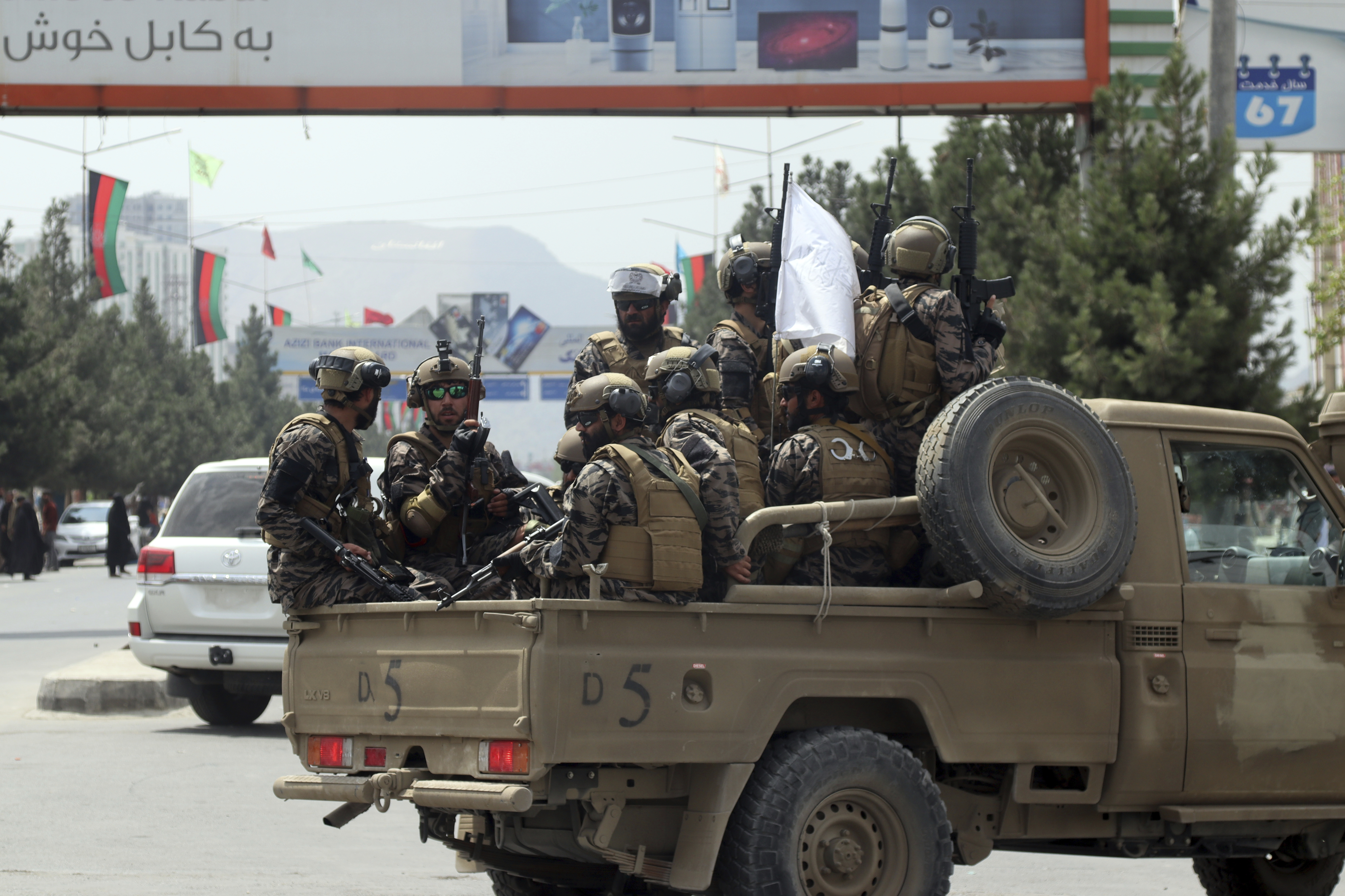 Taliban special force fighters arrive inside the Hamid Karzai International Airport after the U.S. military's withdrawal, in Kabul, Afghanistan, Tuesday, Aug. 31, 2021. The Taliban were in full control of Kabul's international airport on Tuesday, after the last U.S. plane left its runway, marking the end of America's longest war. (AP Photo/Khwaja Tawfiq Sediqi)