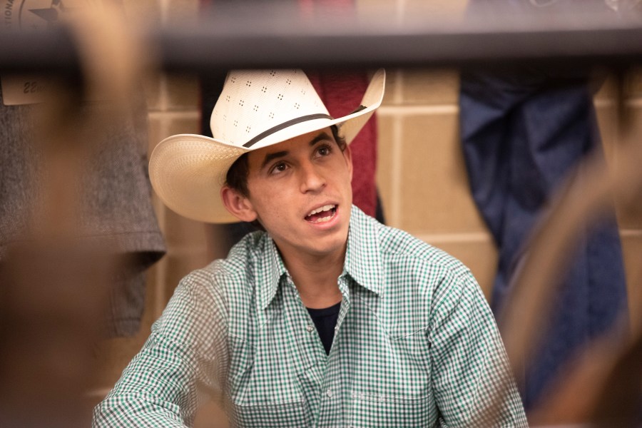 Bull rider Amadeu Campos Silva speaks in a locker room in Bangor, Maine, in March 2020. The Brazilian bull rider was killed Sunday, Aug. 29, 2021, when his spur got caught in a rope, pulling him under the bull, and the animal stepped on his chest in California, according to the Professional Bull Riders touring group. Silva, 22, was competing at a bull-riding Velocity Tour event at the Save Mart Center in Fresno, said Andrew Giangola, a spokesperson for Professional Bull Riders. He was pronounced dead at a hospital. (Andre Silva/Courtesy PBR/Bull Stock Media via AP)