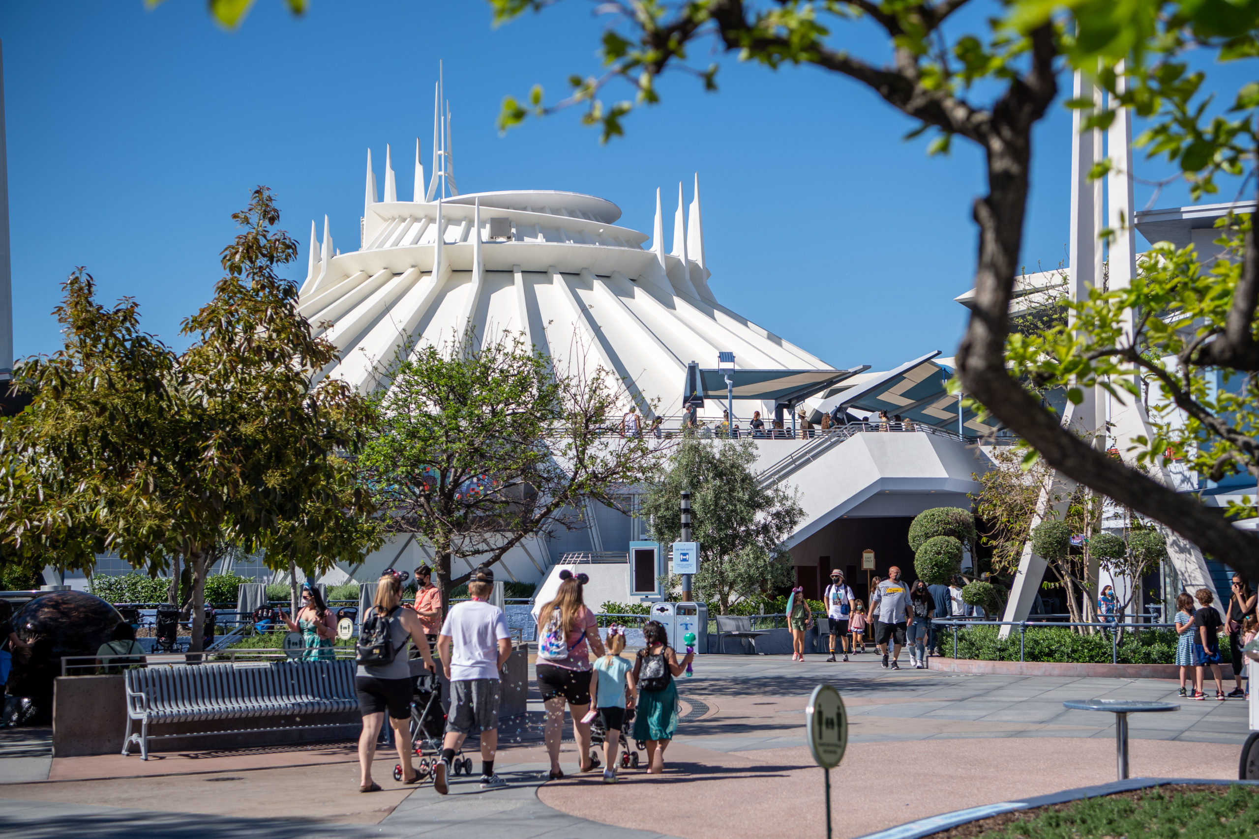 In this handout photo, guests arrive in Tomorrowland at the Disneyland Resort on April 30, 2021, in Anaheim. (Richard Harbaugh/Disneyland Resort via Getty Images)