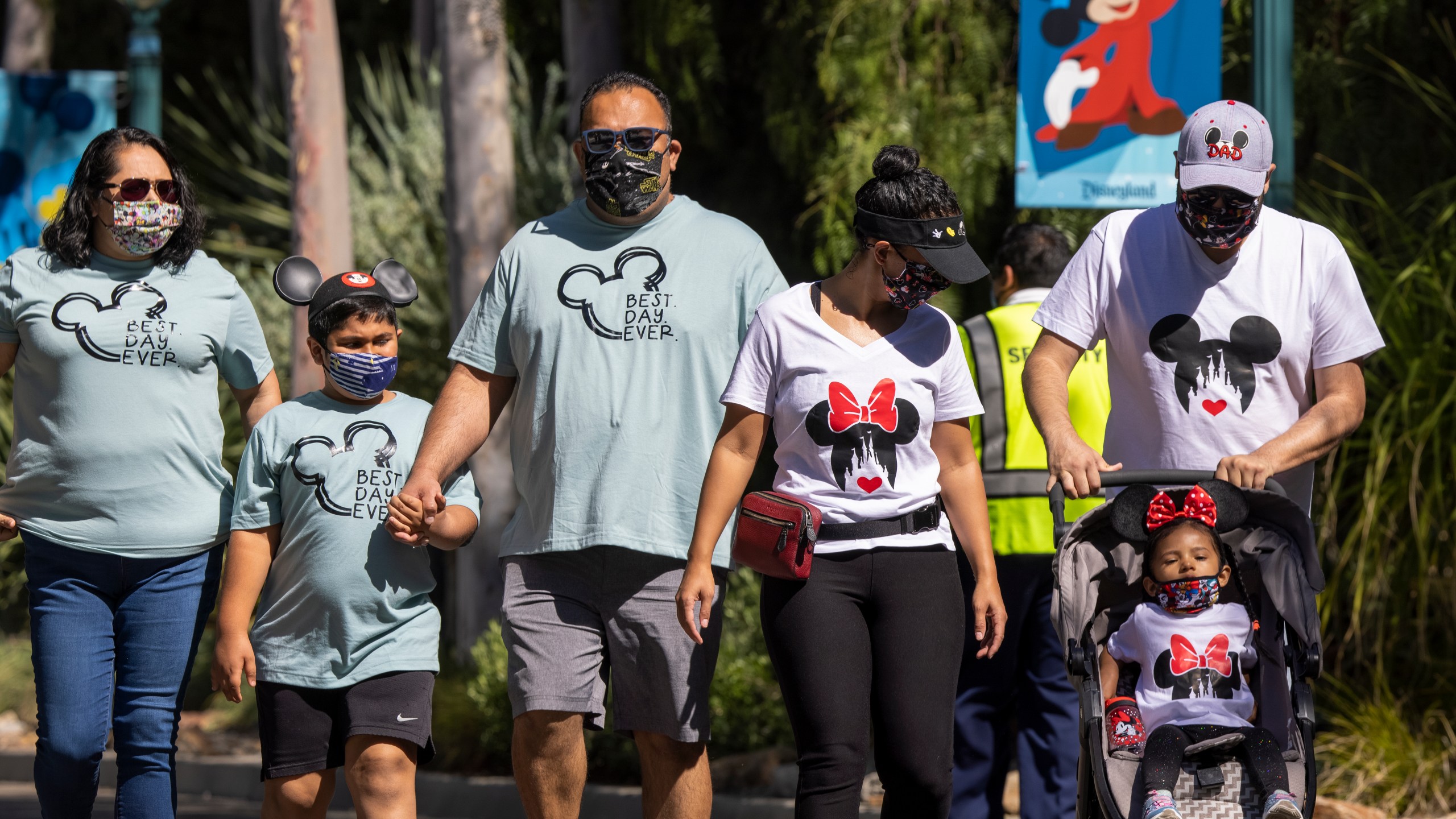 People enter Disneyland Park as it reopens on April 30, 2021, for the first time since the COVID-19 pandemic forced the park to shut down. (David McNew / Getty Images)