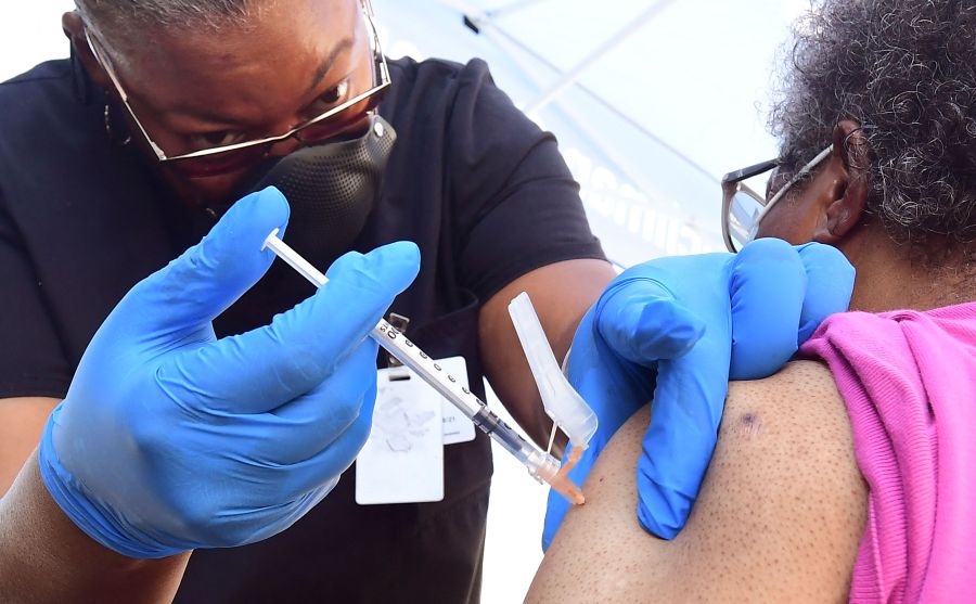 A nurse administers the Pfizer COVID-19 vaccine at a mobile vaccine clinic operated by the Los Angeles County of Public Health on July 16, 2021 in Los Angeles. (FREDERIC J. BROWN/AFP via Getty Images)