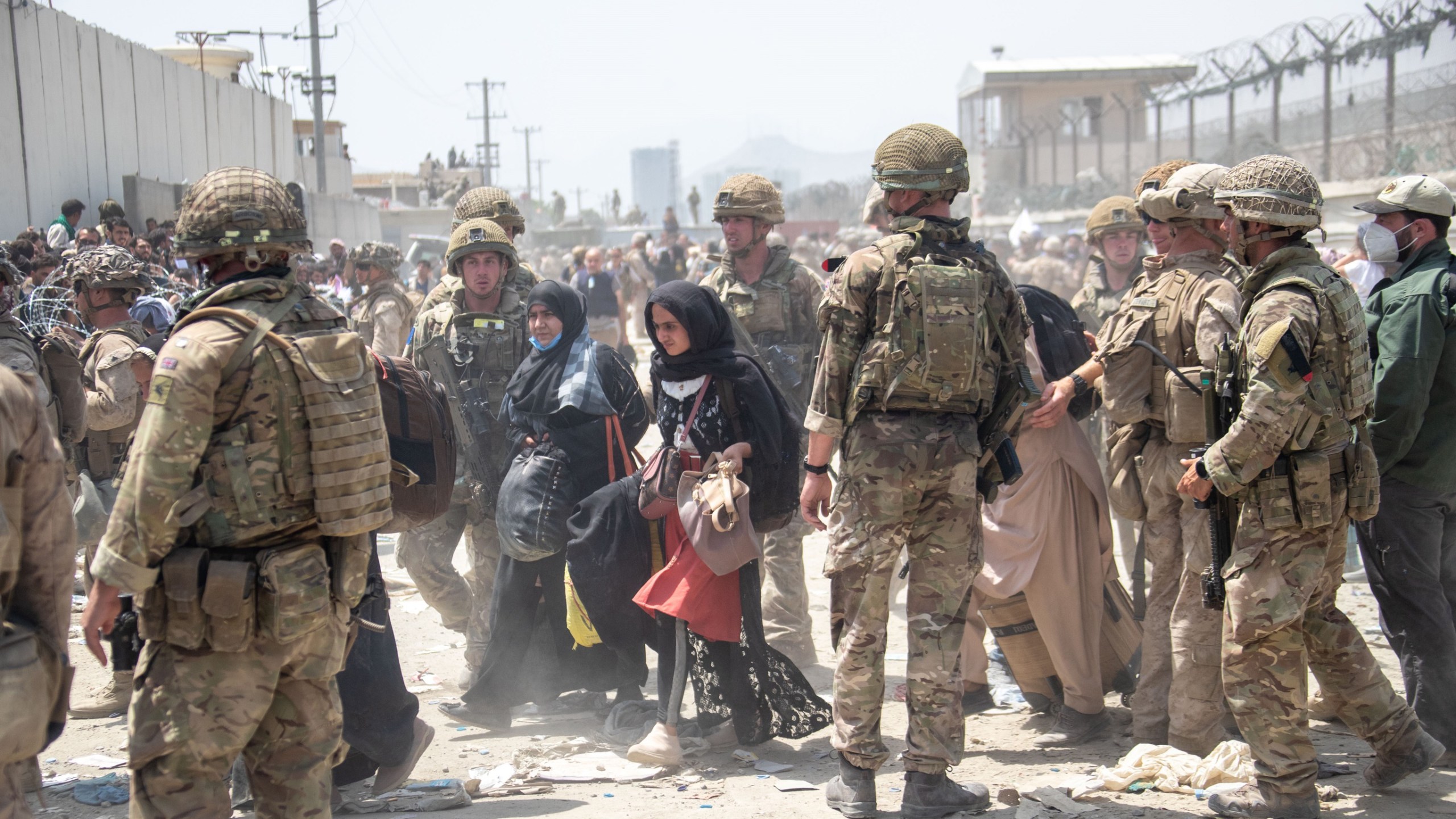 In this handout image provided by the Ministry of Defence, the British armed forces work with the U.S. military to evacuate eligible civilians and their families out of the country on Aug. 21, 2021 in Kabul, Afghanistan. (MoD Crown Copyright via Getty Images)