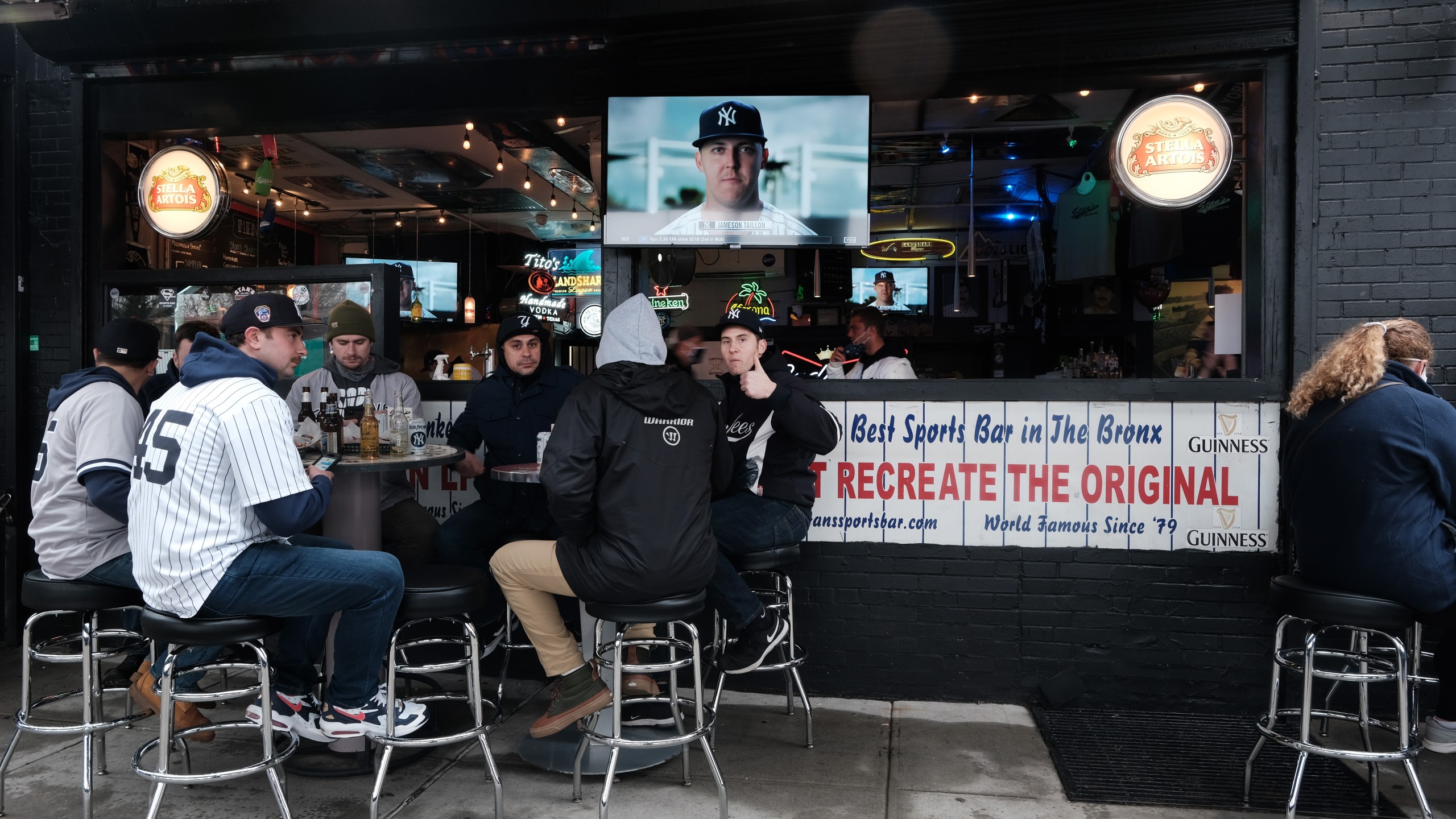 People gather at restaurants and bars outside of Yankee Stadium in the Bronx for the Opening Day of baseball season on April 1, 2021 in New York City. (Spencer Platt/Getty Images)