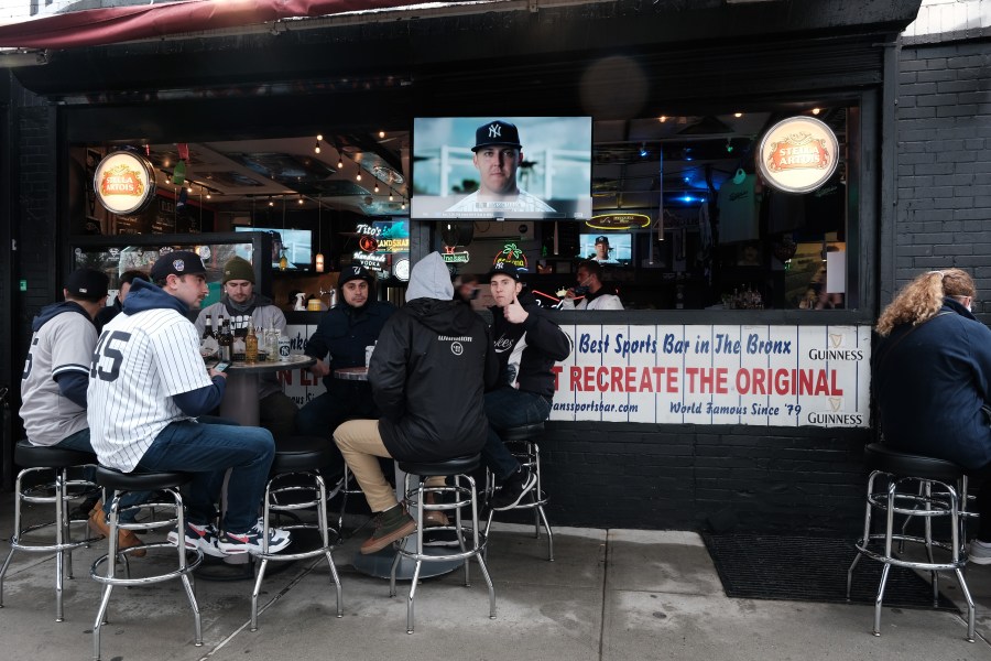 People gather at restaurants and bars outside of Yankee Stadium in the Bronx for the Opening Day of baseball season on April 1, 2021 in New York City. (Spencer Platt/Getty Images)