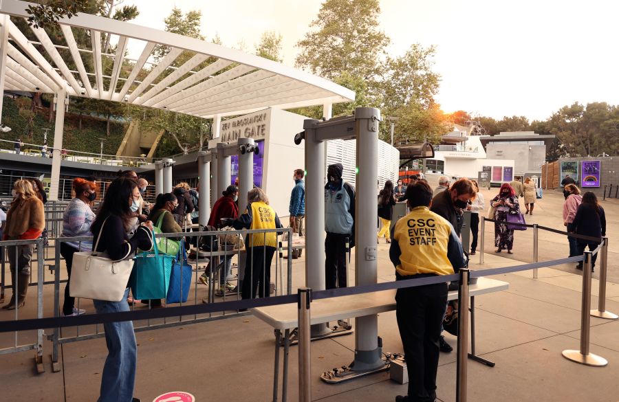 Guests walk through metal detectors and have their bags checked during the reopening of The Hollywood Bowl on May 15, 2021 in Los Angeles. (Amy Sussman/Getty Images)