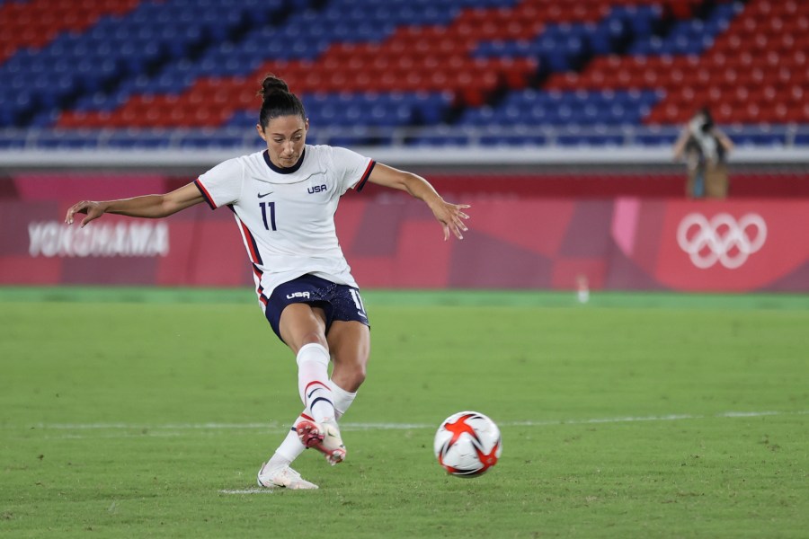 Christen Press of Team United States scores their team's third penalty in the penalty shoot out during the Women's Quarter Final match between Netherlands and United States on day seven of the Tokyo 2020 Olympic Games at International Stadium in Yokohama on July 30, 2021. (Griffiths/Getty Images)