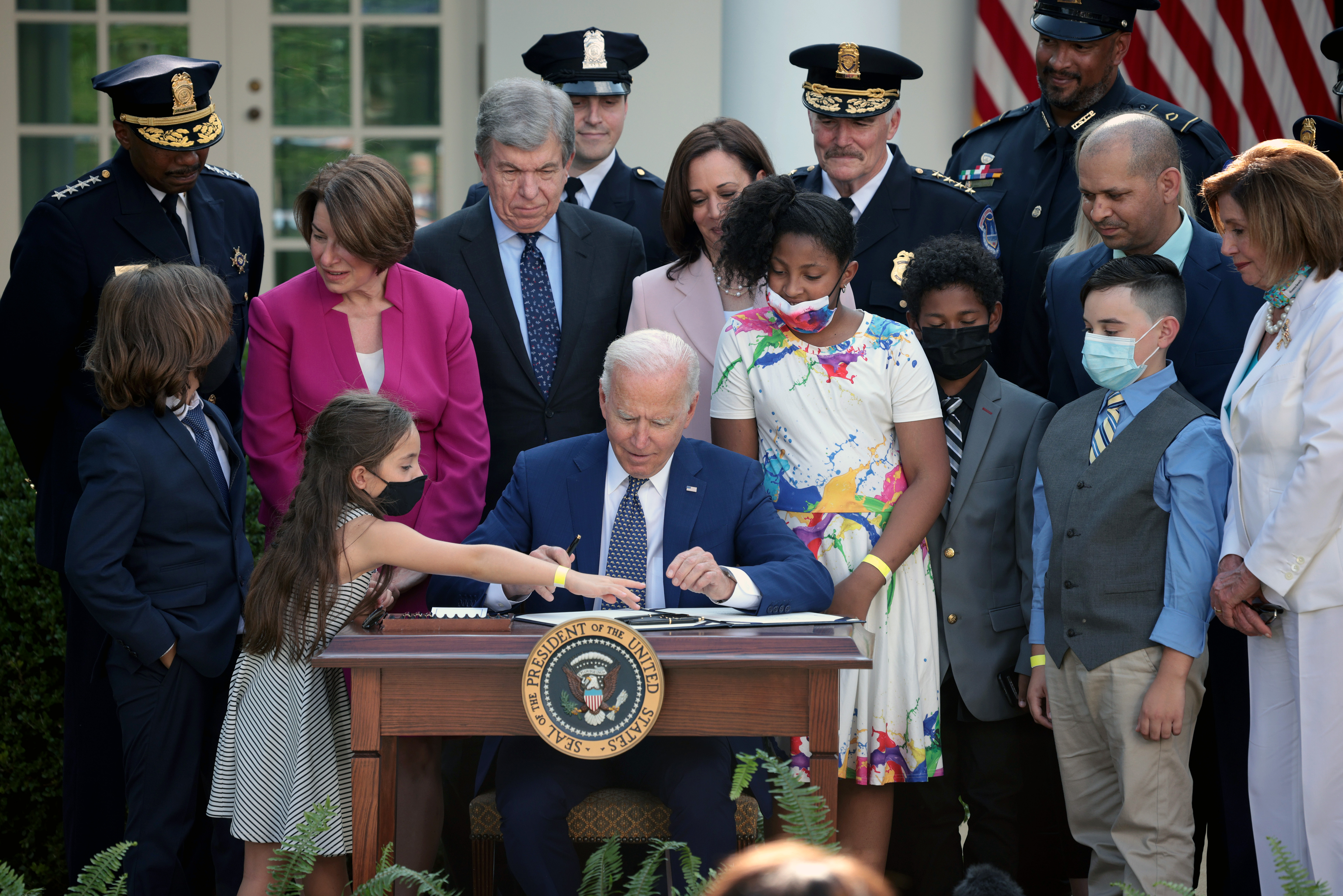 President Joe Biden, joined by lawmakers and members of law enforcement and their families, signs legislation to award congressional gold medals to law enforcement in the Rose Garden of the White House on August 5, 2021 in Washington, DC. Biden spoke before signing H.R. 3325, legislation to award four congressional gold medals to the United States Capitol Police and those who protected the U.S. Capitol on January 6, 2021. (Win McNamee/Getty Images)