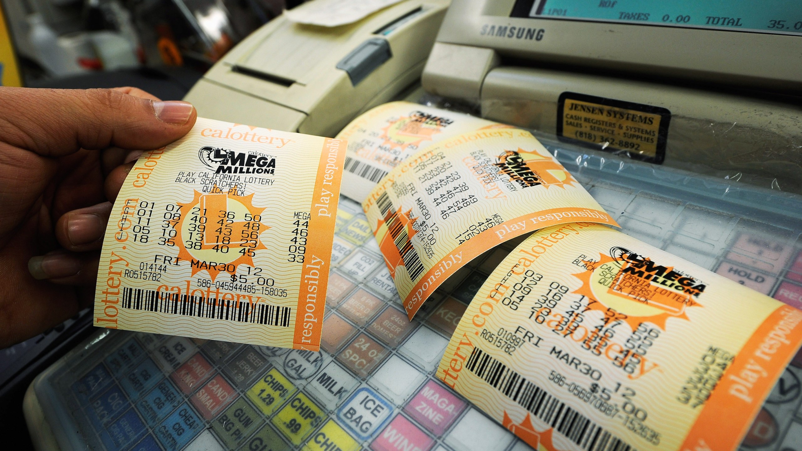 In this file photo, Mega Millions lottery tickets sit on a register at Liquorland on March 30, 2012 in Covina. (Kevork Djansezian/Getty Images)