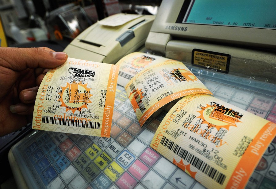 In this file photo, Mega Millions lottery tickets sit on a register at Liquorland on March 30, 2012 in Covina. (Kevork Djansezian/Getty Images)