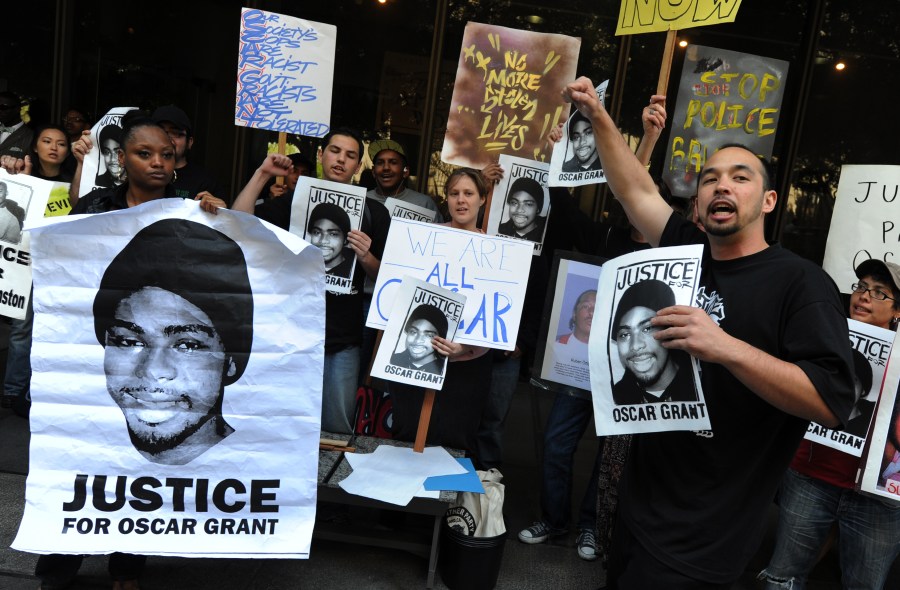 In this file photo, Aidge Patterson of the LA Coalition for Justice for Oscar Grant leads a protest rally outside a pretrial hearing for Johannes Mehserle, the former Bay Area Rapid Transit officer charged with murder in the shooting death of Grant in Oakland last year at the Criminal Courts Building in Los Angeles on March 26, 2010. (MARK RALSTON/AFP via Getty Images)