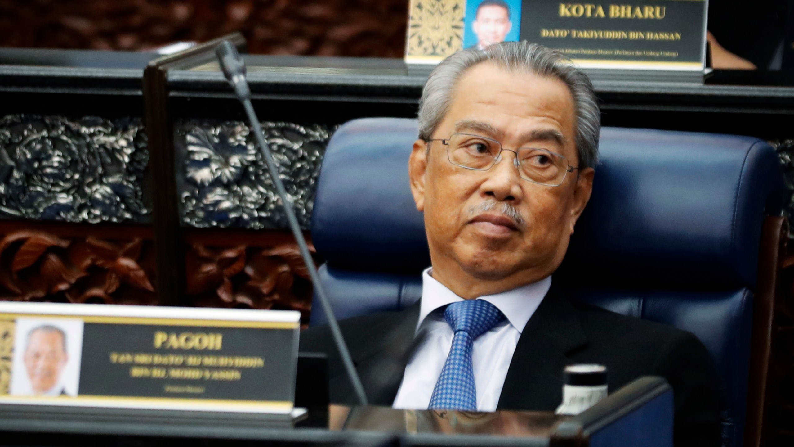 In this July 13, 2020, photo, Malaysian Prime Minister Muhyiddin Yassin attends a Parliament session at lower house in Kuala Lumpur, Malaysia. (AP Photo/Vincent Thian)