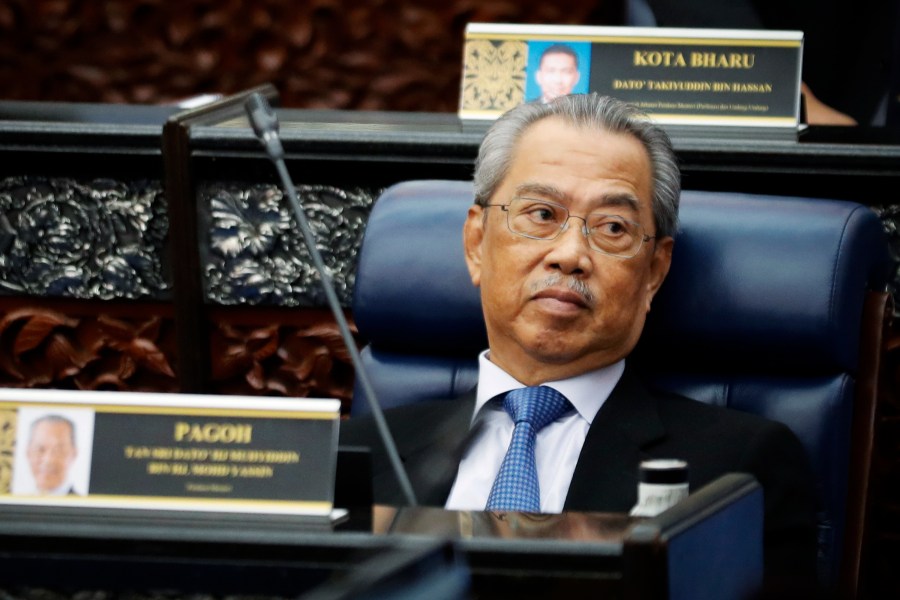 In this July 13, 2020, photo, Malaysian Prime Minister Muhyiddin Yassin attends a Parliament session at lower house in Kuala Lumpur, Malaysia. (AP Photo/Vincent Thian)