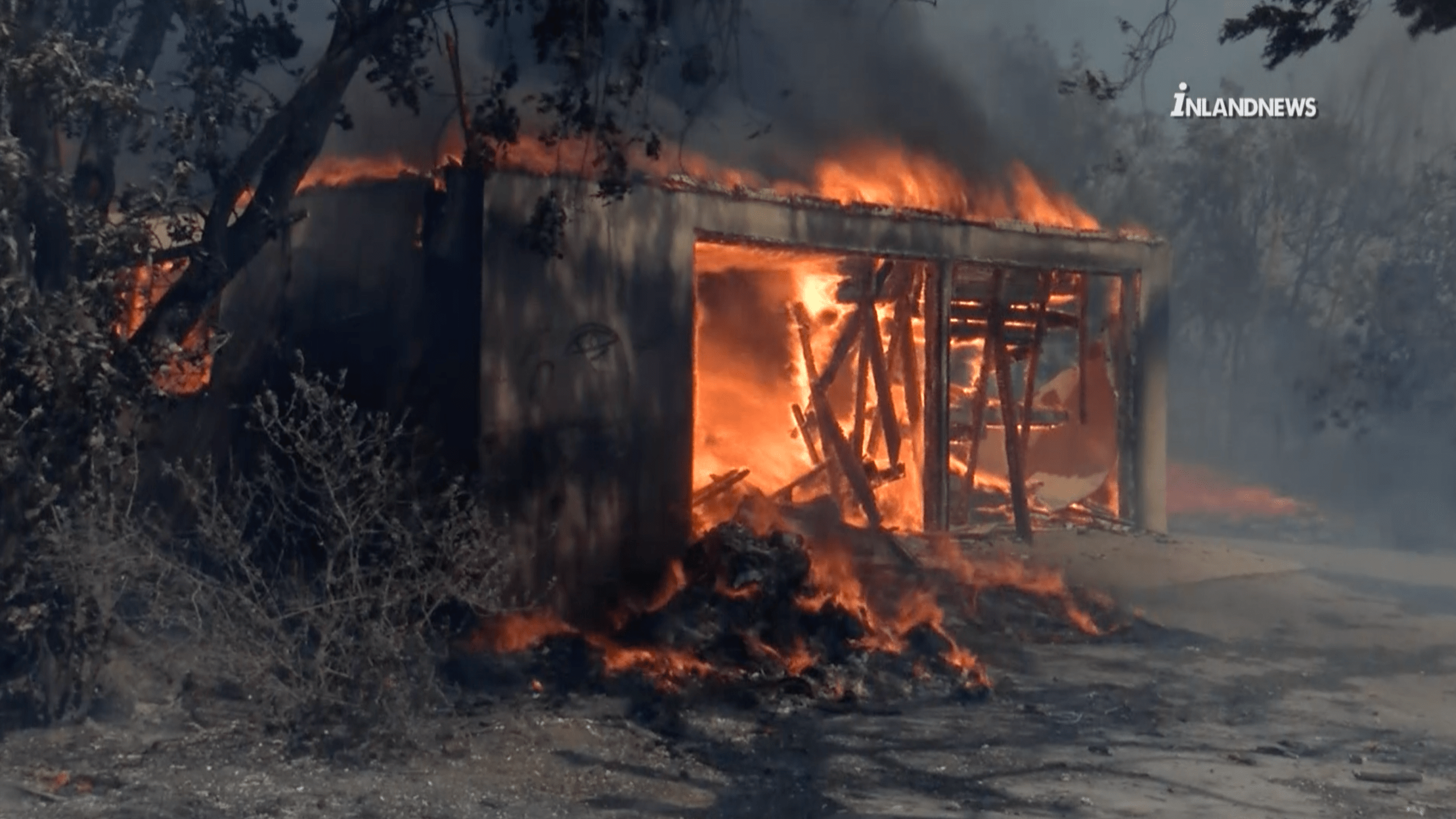 The South Fire burns a structure north of Fontana on Aug. 25, 2021. (Inland News)